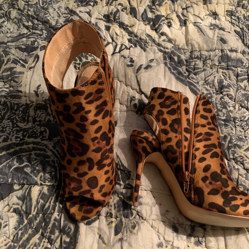 Gorgeous leopard ankle boot. Peep toe, open heel.